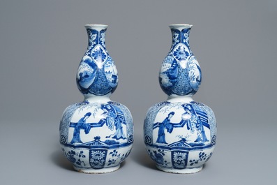 A pair of Dutch Delft blue and white double gourd chinoiserie vases, 18th C.